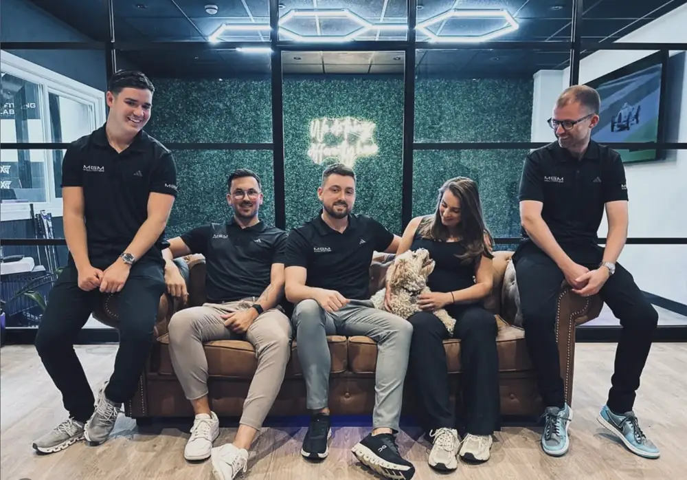 The MY GOLF MATTERS team at their studio, with owner Matt seated in the centre