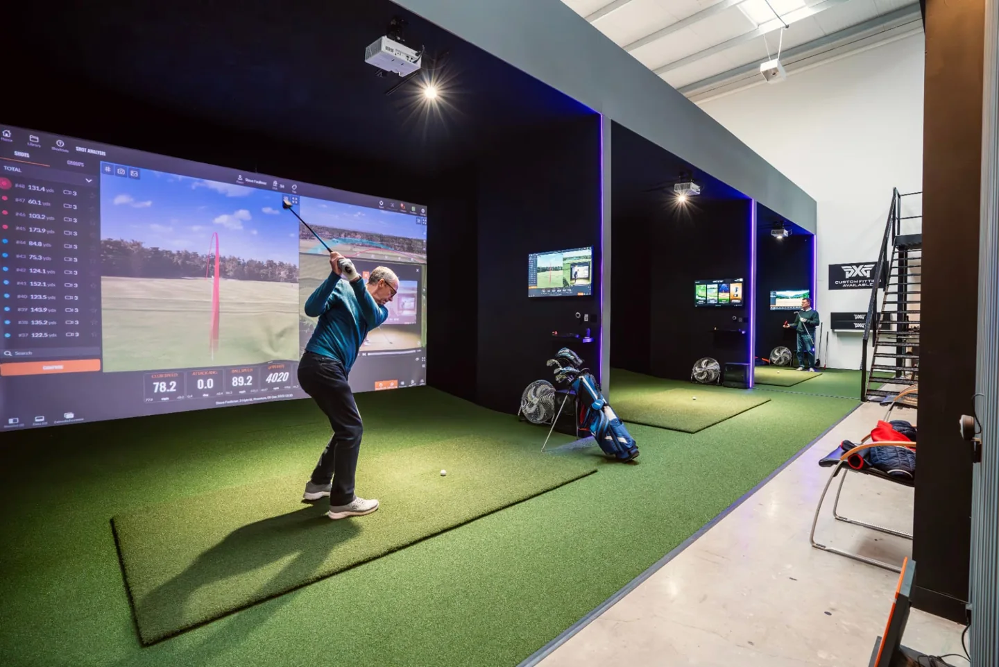 Golfers practising in the actual My Golf Matters indoor studio
